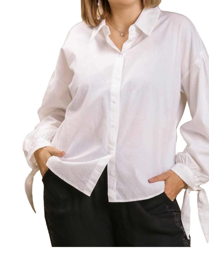Front of a model wearing a size 1XL Button Top With Tie Sleeves in White in White by Umgee. | dia_product_style_image_id:325948